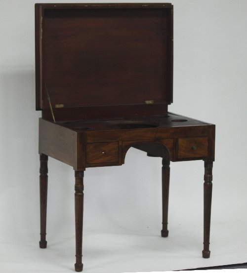 Appraisal: A th Century mahogany washstand with hinged lid and fitted