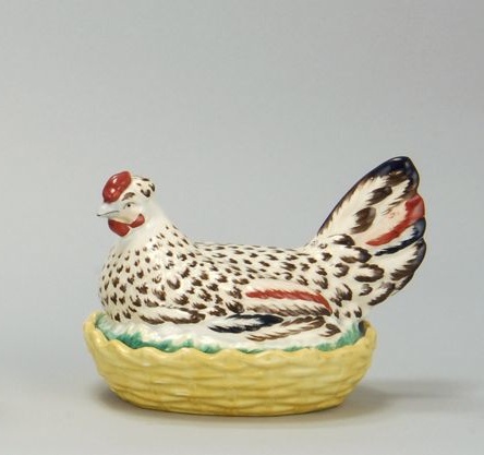 Appraisal: STAFFORDSHIRE HEN ON NEST Circa Cream hen with yellow basketweave