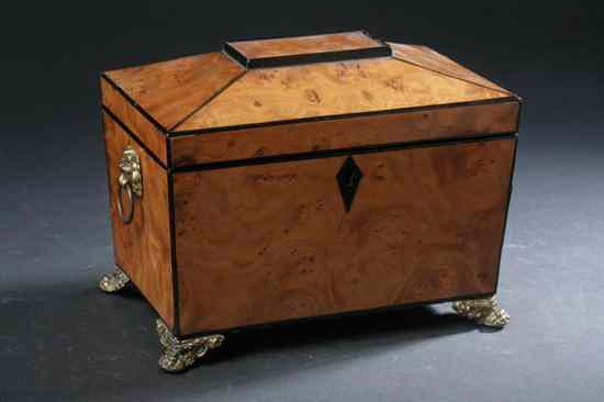 Appraisal: GEORGE III BURR WALNUT TEA CADDY early th century Sarcophagus