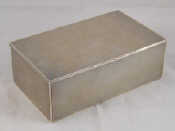 Appraisal: A silver cigarette box with engine turned finish London wt