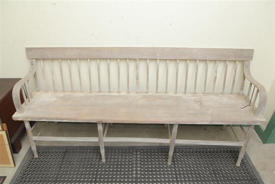 Appraisal: PRIMITIVE SETTLE BENCH Pine having a banister back bentwood arms