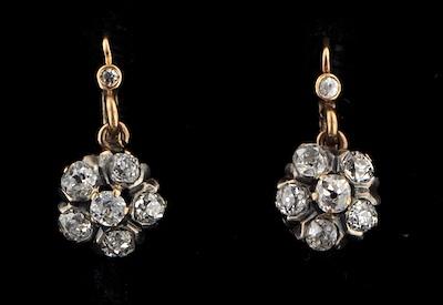 Appraisal: A Pair of Diamond Cluster Earrings k yellow gold earrings