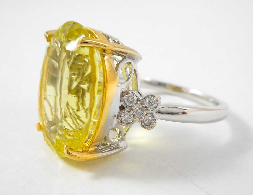 Appraisal: LEMON TOPAZ DIAMOND AND FOURTEEN KARAT GOLD RING The white