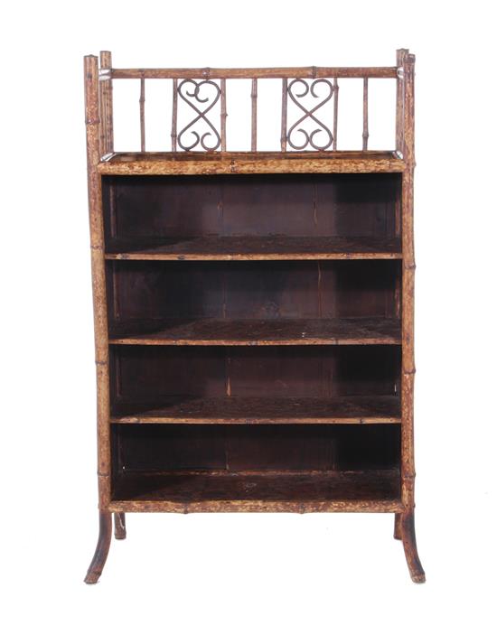 Appraisal: Aesthetic bamboo and lacquered bookshelf late th century pierced railing