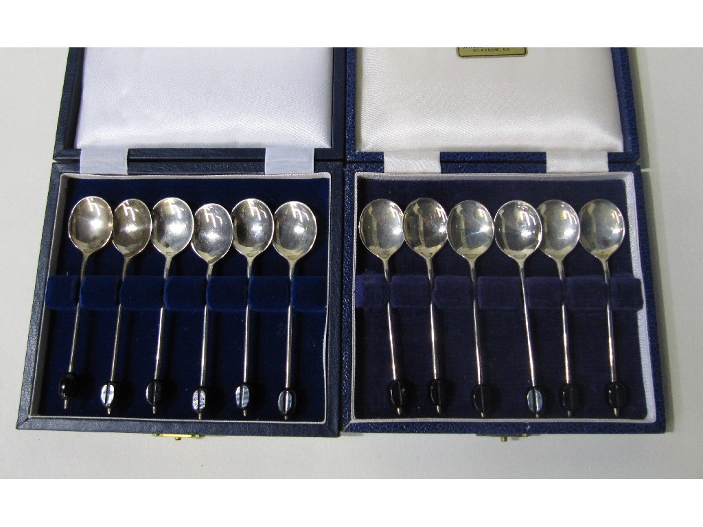 Appraisal: Lot comprising two cased sets of six silver coffee bean