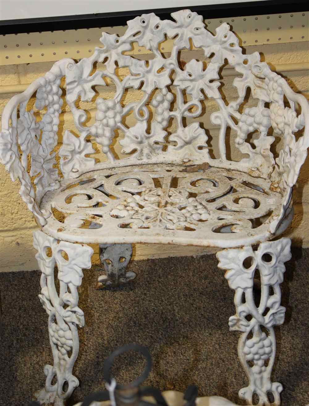 Appraisal: CHILD-SIZED ANTIQUE CAST-IRON SETTEE TABLE TWO CHAIRS of diminutive size