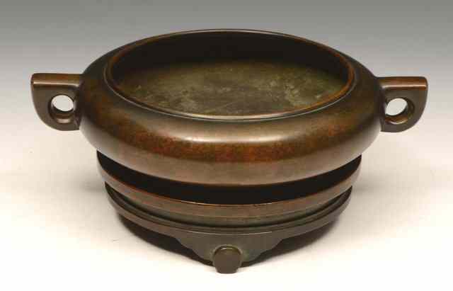 Appraisal: A CHINESE BRONZE CENSER and stand of archaic form with