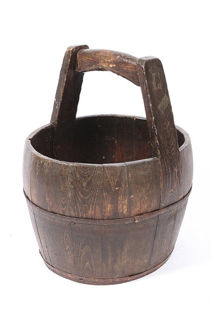 Appraisal: AN OLD COOPERED IRON BOUND BUCKET with a handle to