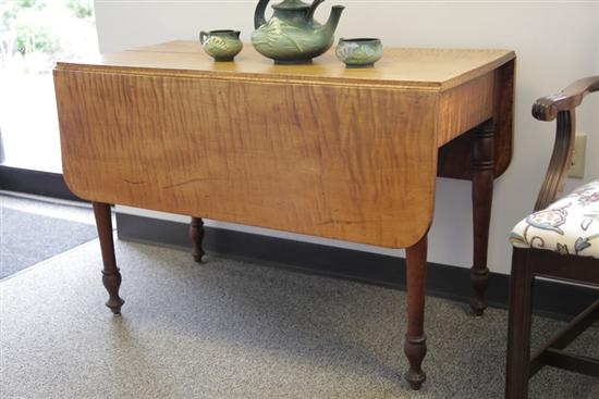 Appraisal: CURLY MAPLE DROP LEAF TABLE Having turned legs Top supported