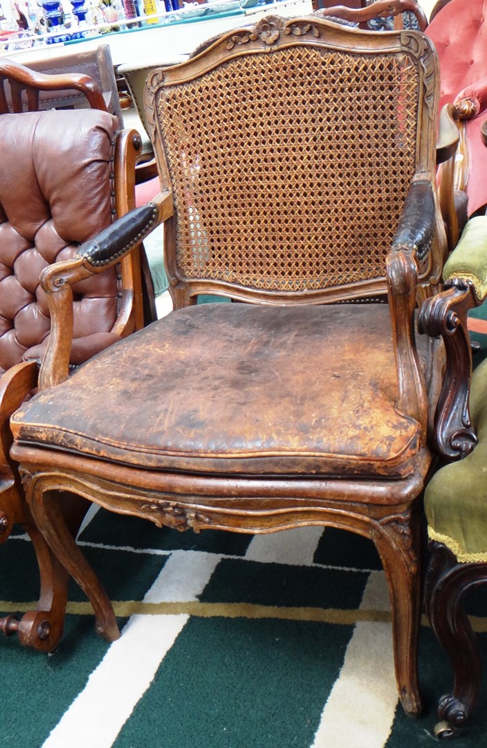 Appraisal: An th century French beech framed open arm fauteuil with