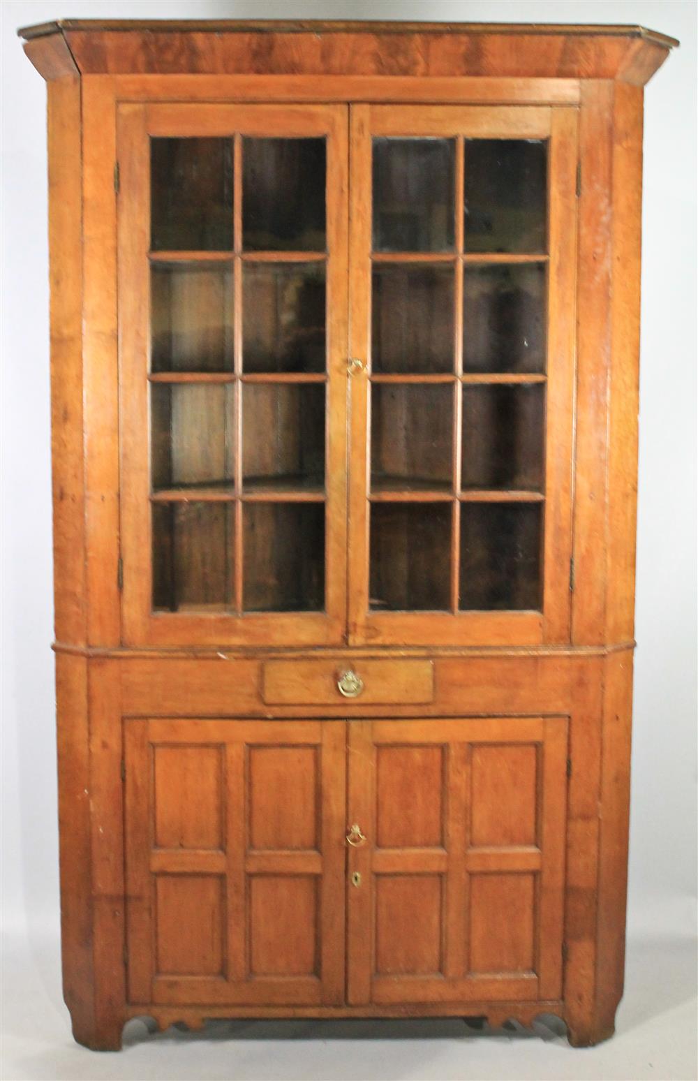 Appraisal: AMERICAN CHERRYWOOD AND MAHOGANY CORNER CUPBOARD CA having a molded