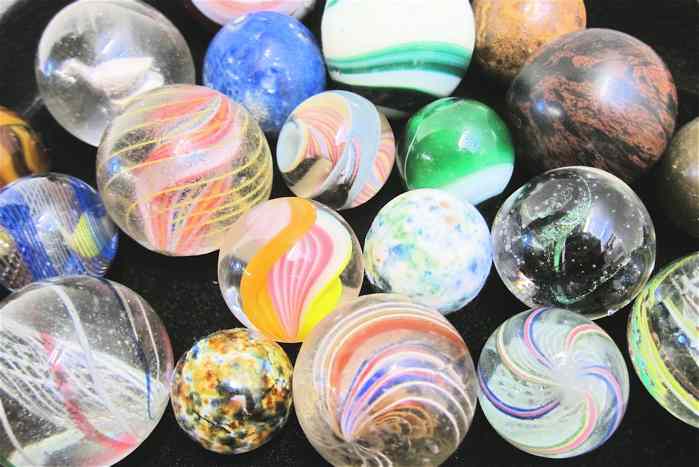 Appraisal: TWENTY LARGER HAND MADE COLLECTIBLE MARBLES latticinio core swirls solid