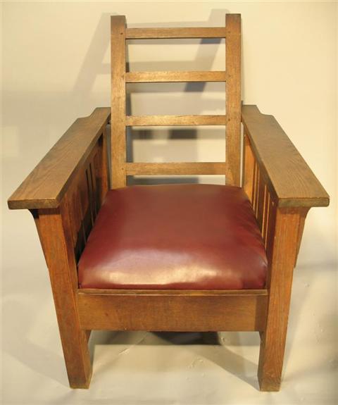 Appraisal: MISSION OAK ARM CHAIR Mortised construction with hinged ladder back