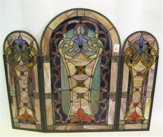 Appraisal: A STAINED AND LEADED GLASS FIREPLACE SCREEN in three panels