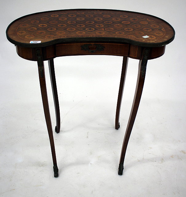 Appraisal: A FRENCH WALNUT KIDNEY SHAPED OCCASIONAL TABLE parquetry decoration to