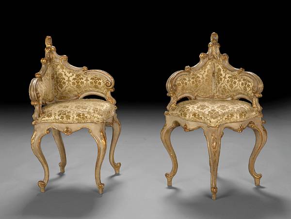 Appraisal: A pair of Italian Rococo style painted parcel gilt corner