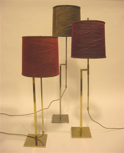 Appraisal: Three floor lamps MID TH CENTURY Adjustable floor metal lamps