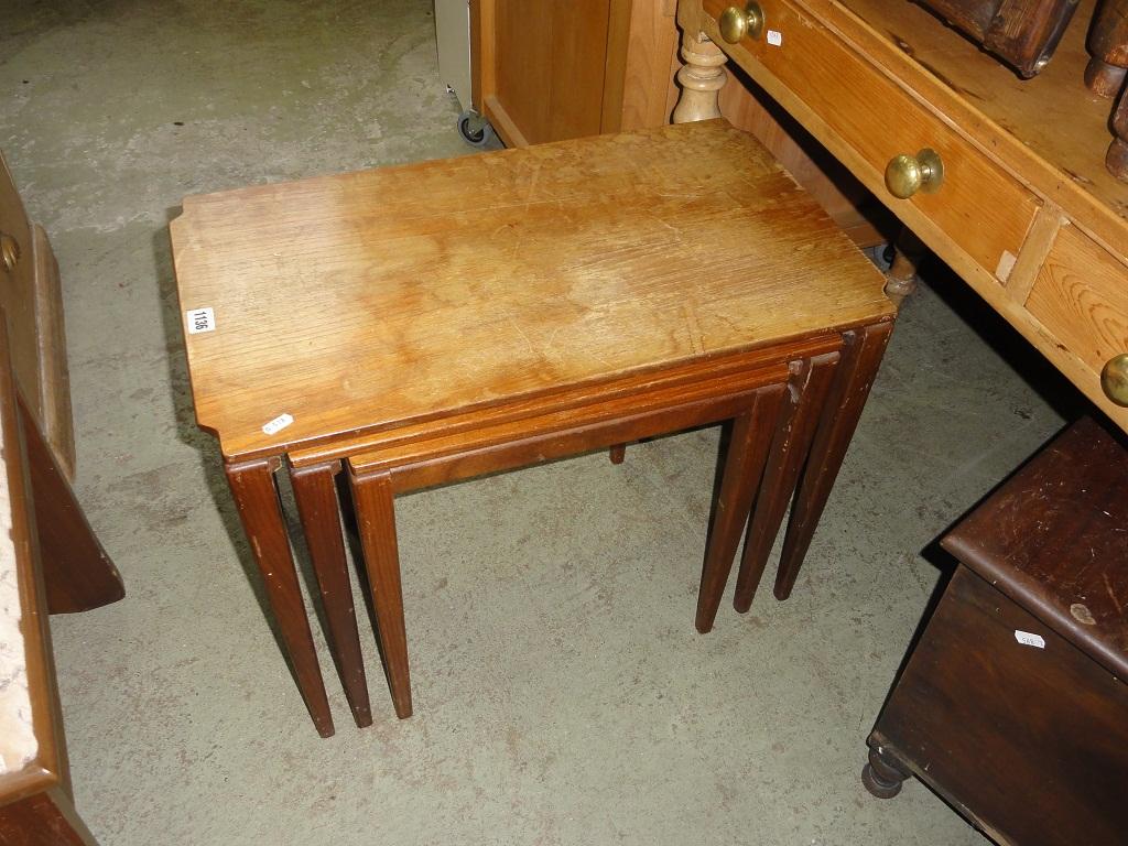 Appraisal: A nest of three graduated teak wood occasional tables of