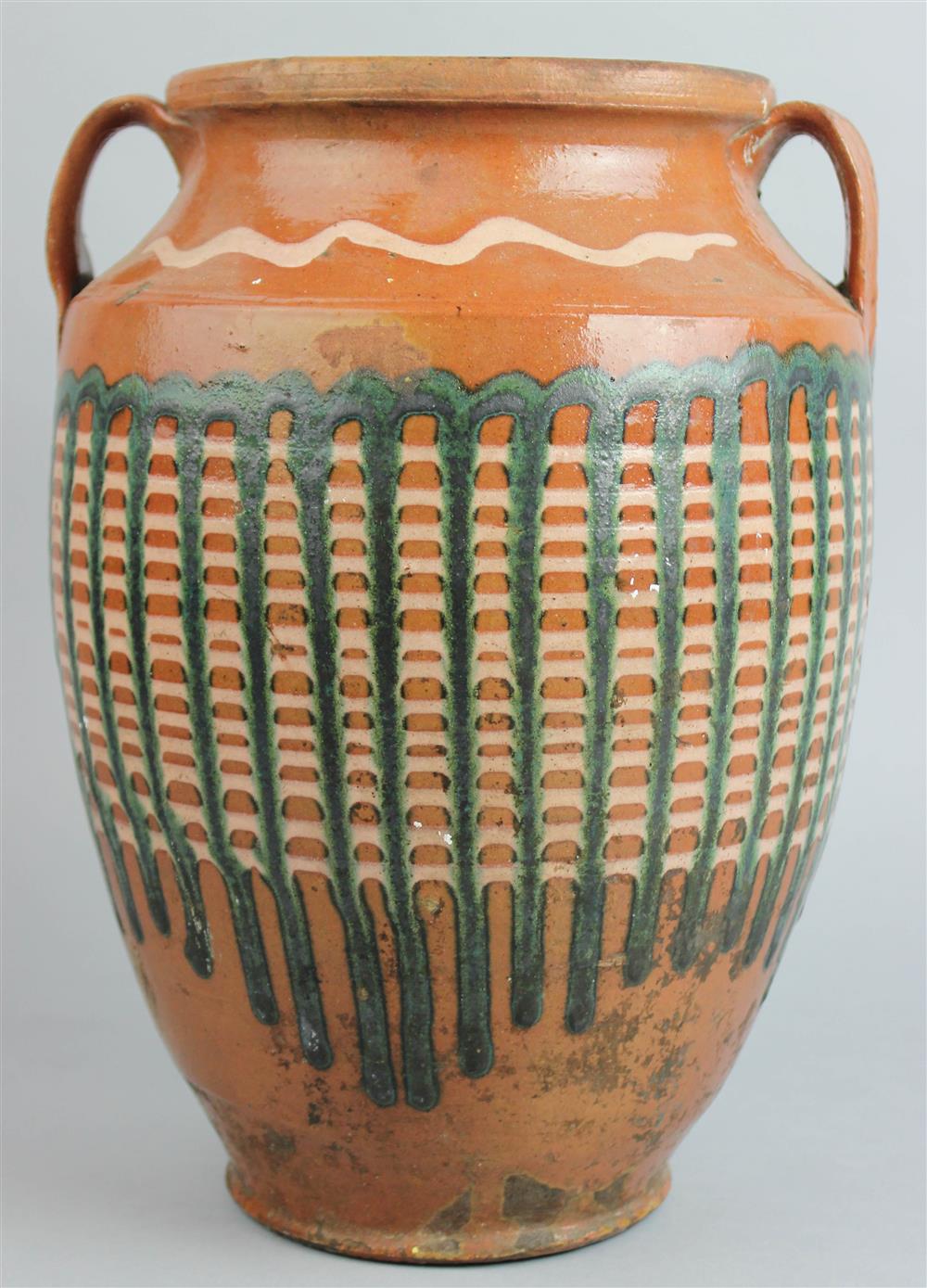 Appraisal: MID-ATLANTIC SLIP-DECORATED REDWARE JAR with applied handles slip decorated squiggled