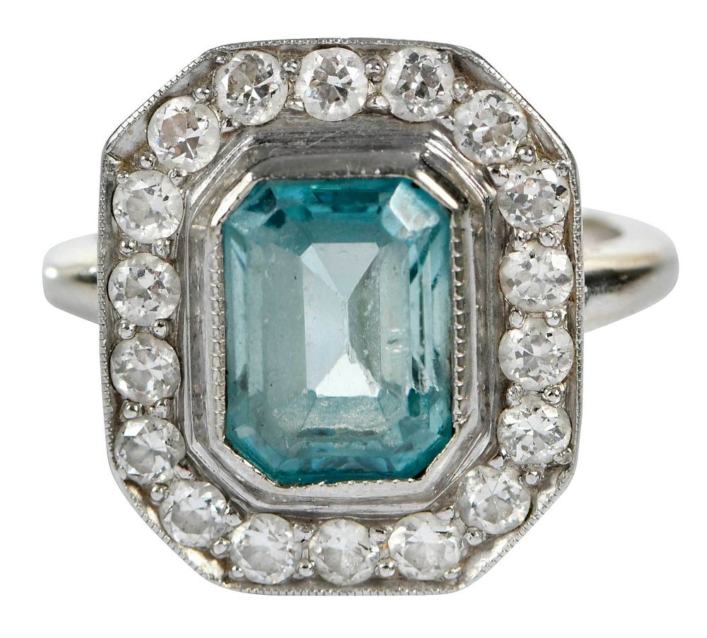 Appraisal: Platinum Gold and Gemstone Ring center emerald cut blue topaz