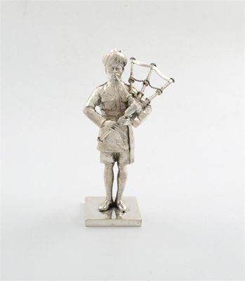 Appraisal: A silver statue of an Indian Regimental bagpiper by Mappin