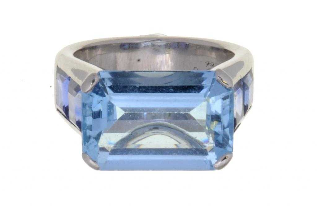 Appraisal: A CARTIER AQUAMARINE AND SAPPHIRE RING with a larger step