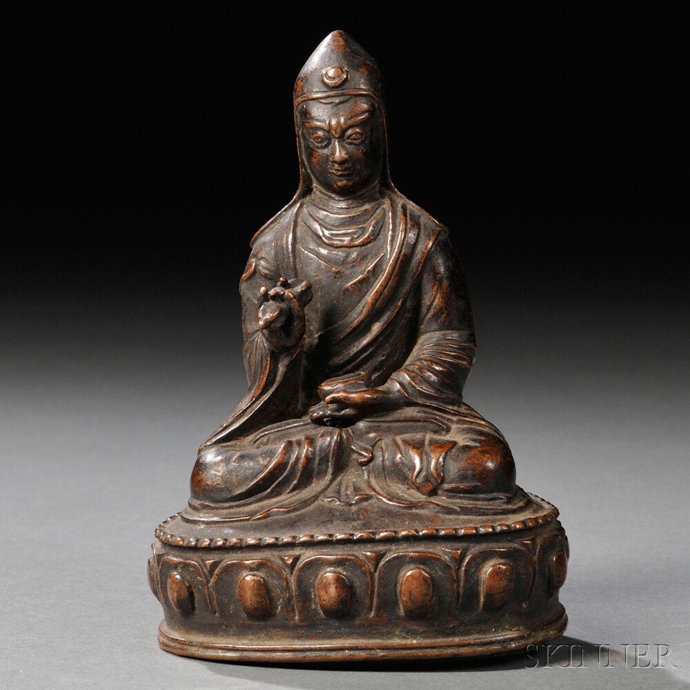 Appraisal: Bronze Figure of a Lama Tibet depicted holding Buddhist instruments