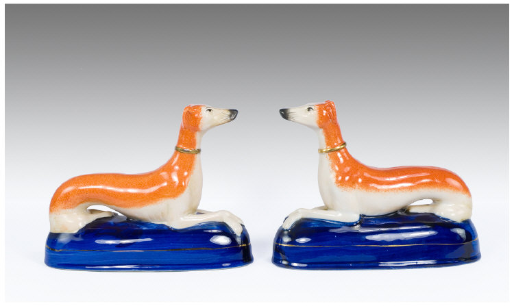 Appraisal: Staffordshire Style Pair of Greyhound Figures pen holders each inches