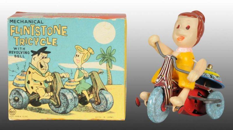 Appraisal: Marx Celluloid Tin Wilma Flintstone Tricycle Toy Description Wind-up working