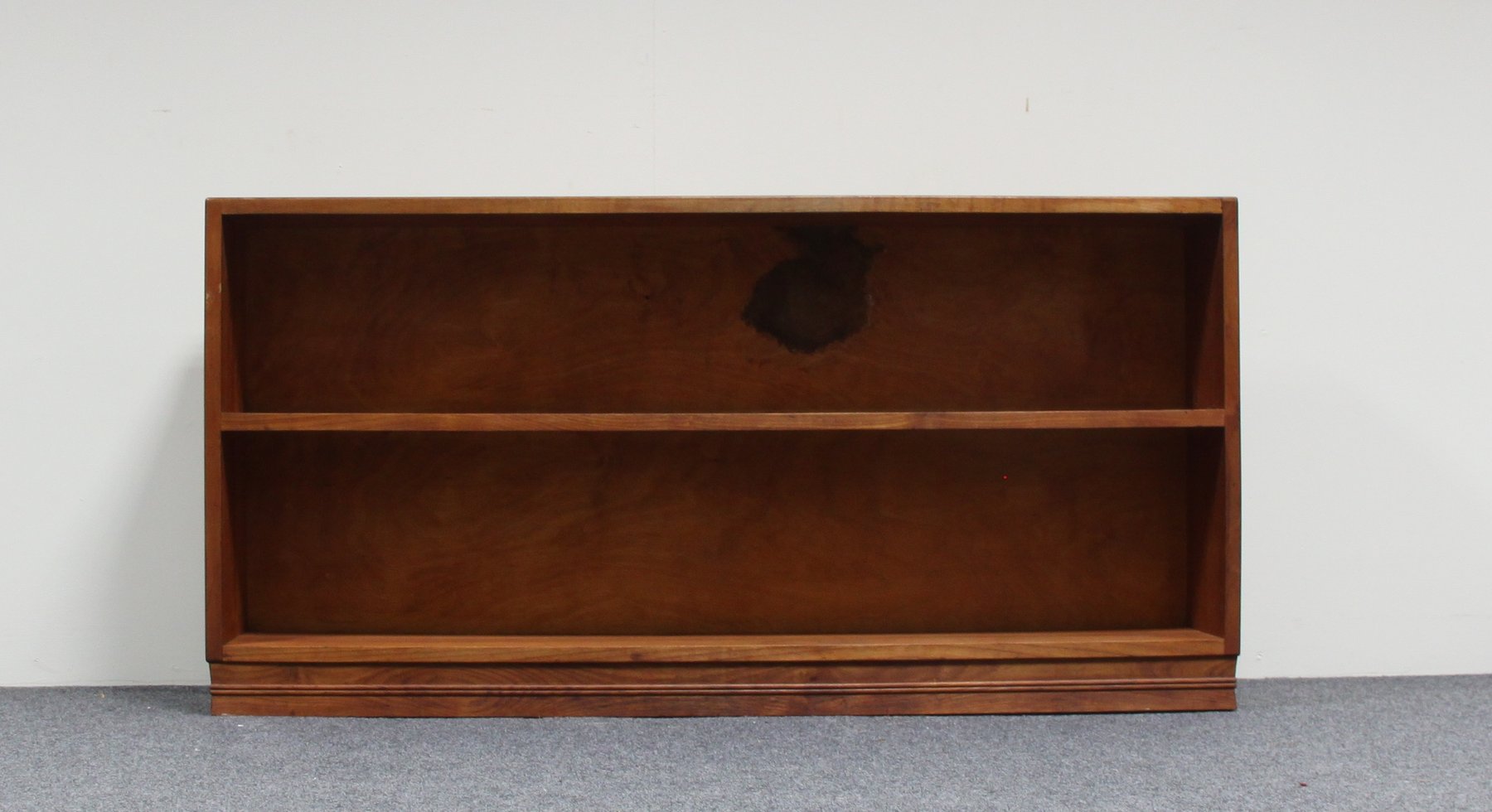 Appraisal: A Gordon Russell walnut hanging bookshelf bearing a label Russell