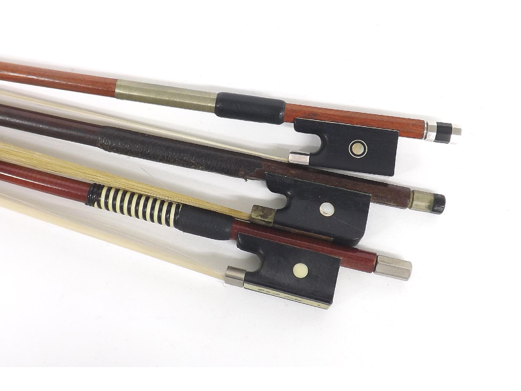 Appraisal: Old nickel mounted violoncello bow and two violin bows