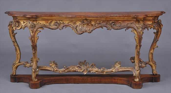 Appraisal: ENGLISH VICTORIAN INLAID WALNUT-TOP CARVED GILTWOOD CONSOLE TABLE The serpentine-fronted