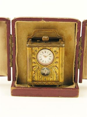 Appraisal: A Swiss miniature gilt brass clock with a lever escapement