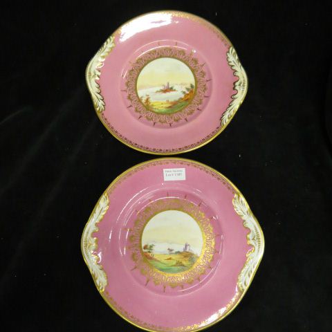 Appraisal: Pair of Fine English Porcelain Cake Plates handpainted landscapes pink