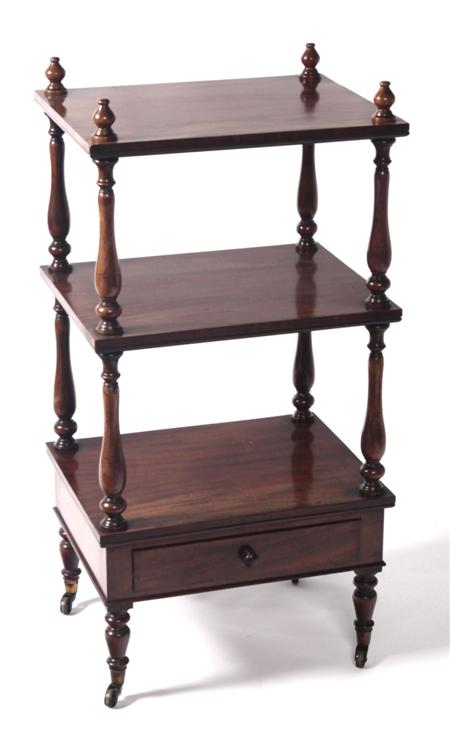 Appraisal: A Regency mahogany three-tier whatnot the rectangular shelves raised on