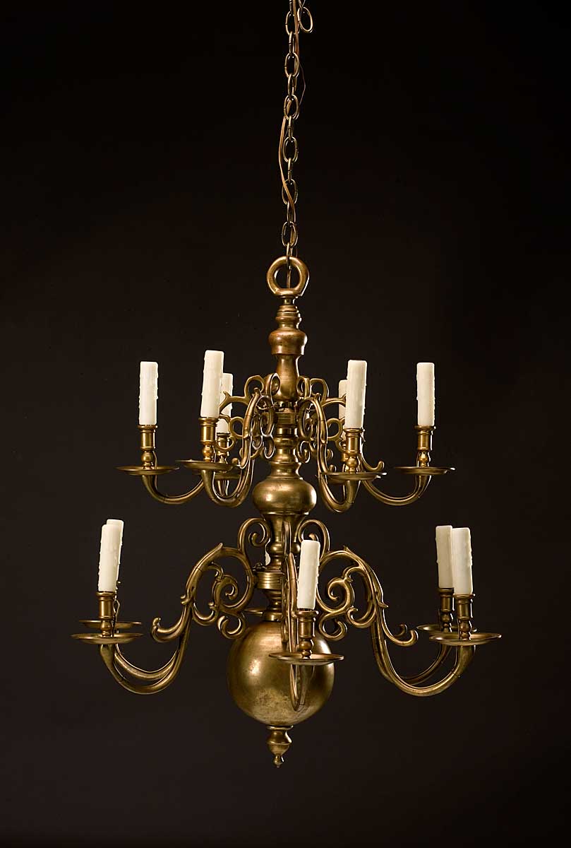 Appraisal: DUTCH ROCOCO STYLE BRASS TWO-TIER CHANDELIER The spherical standard issuing