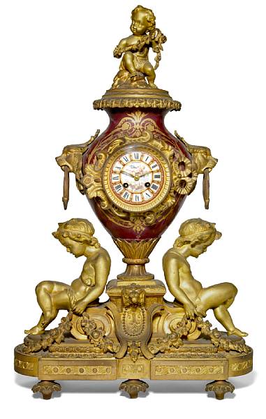 Appraisal: A Louis XV style porcelain and gilt bronze mantel clock