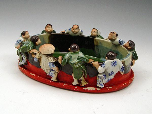 Appraisal: JAPANESE SUMIDA GAWA EARTHENWARE BOWL figures hanging on to the