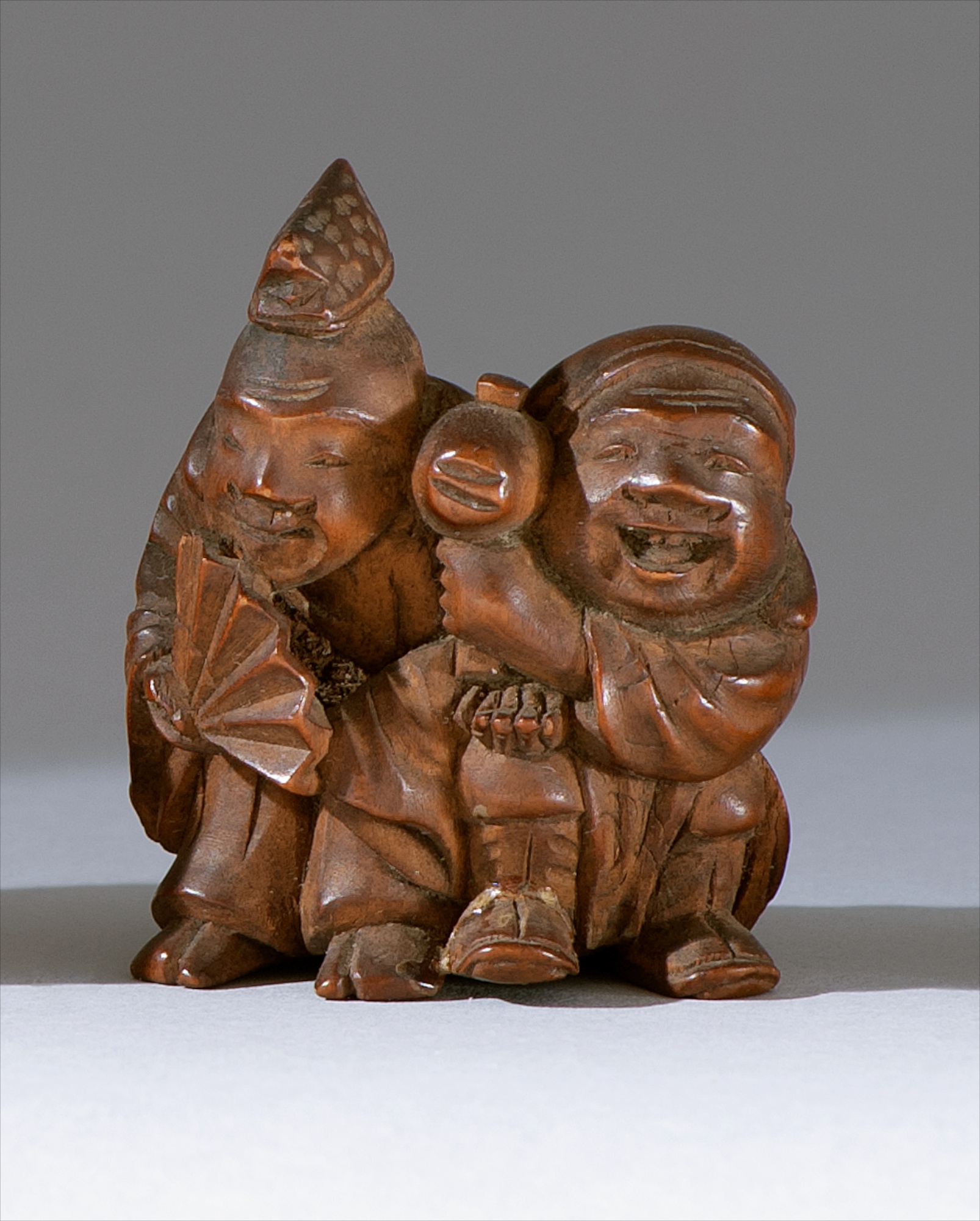 Appraisal: WOOD NETSUKE Early th CenturyDepicting Daikoku and Ebisu Height cm