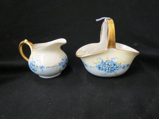 Appraisal: Handpainted Porcelain Sugar Basket Creamer elegant floral gold trim basket