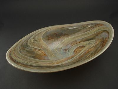 Appraisal: A large early Sam Herman glass bowl irregular form decorated