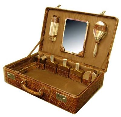 Appraisal: A crocodile travelling case with a fitted interior having an