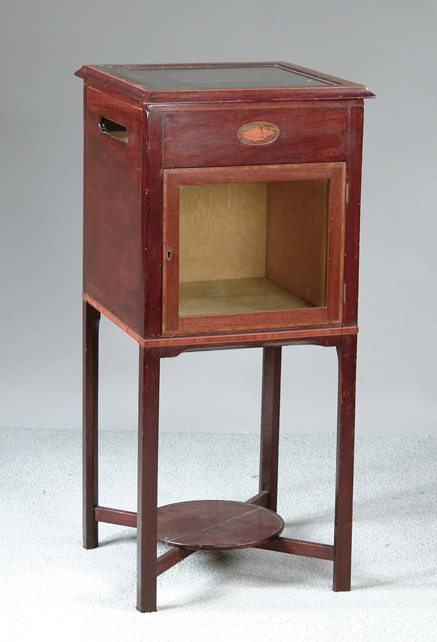 Appraisal: INLAID DISPLAY TABLE Nice little mahogany table has glass door