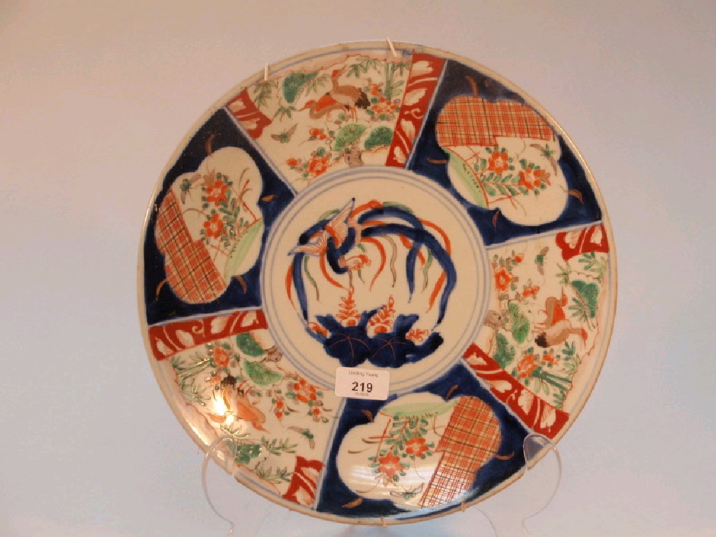 Appraisal: An Imari charger decorated with reserves of birds and flowers