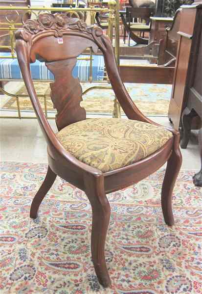 Appraisal: A SET OF FOUR CARVED MAHOGANY DINING CHAIRS American Victorian