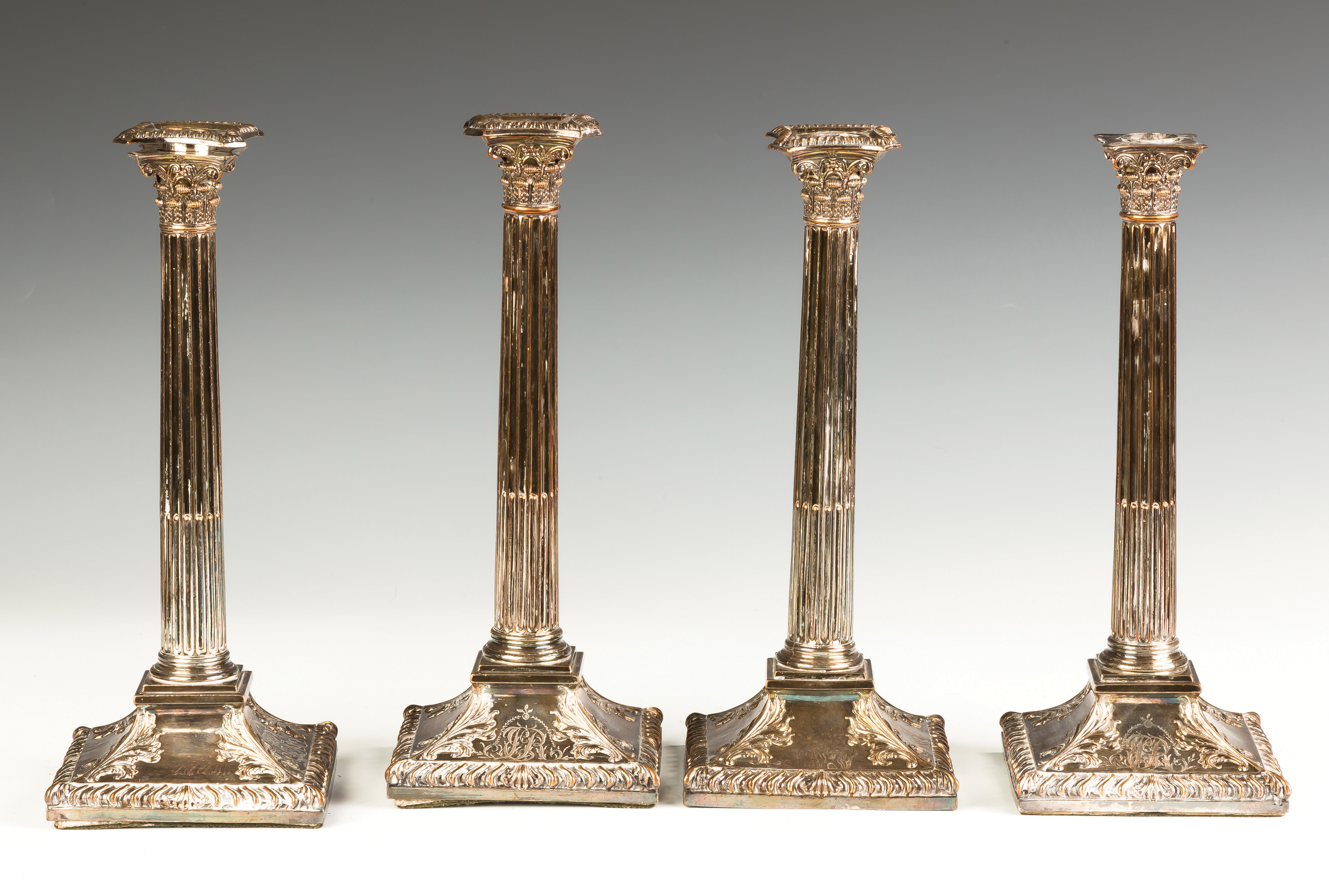 Appraisal: Set of Four Sheffield Silver Plate Candlesticks Overall wear missing