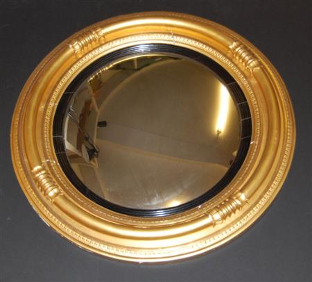 Appraisal: A Regency style giltwood convex wall mirror of circular form