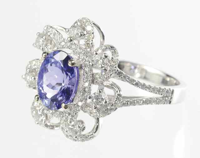 Appraisal: TANZANITE AND DIAMOND RING k white gold with round-cut diamonds