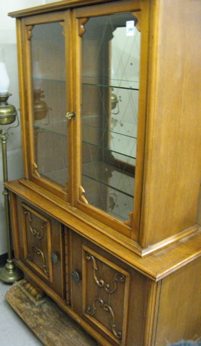 Appraisal: AN OAK AND MAPLE CHINA DISPLAY CABINET ON CABINET Continental