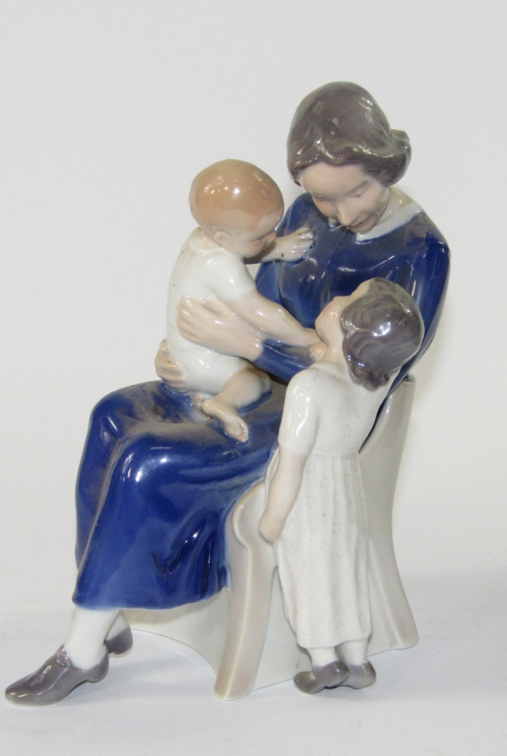 Appraisal: A Royal Copenhagen figure group of a mother in a